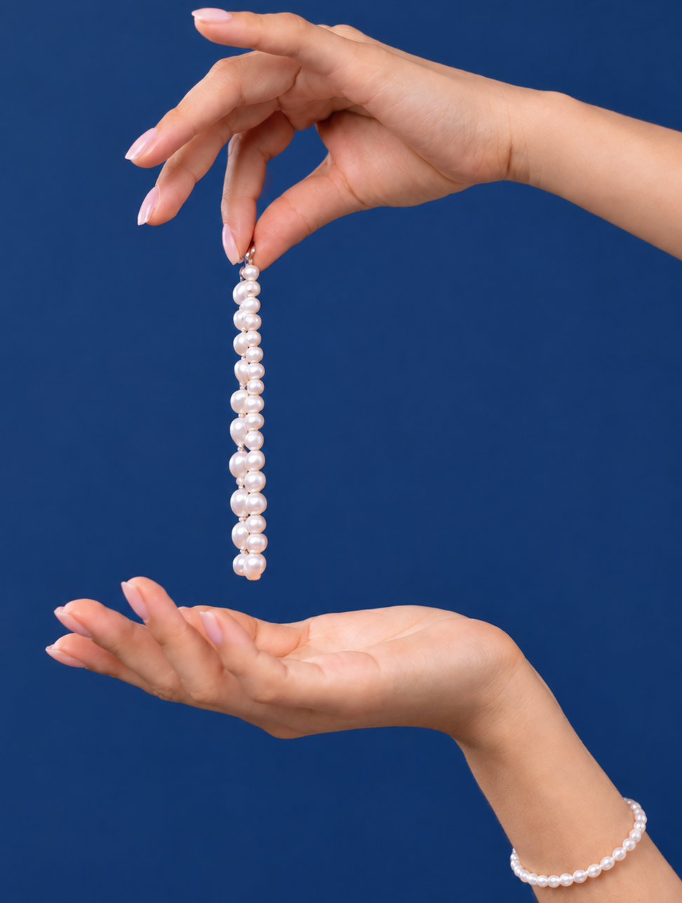 A person naturally adjusting a bracelet on their wrist